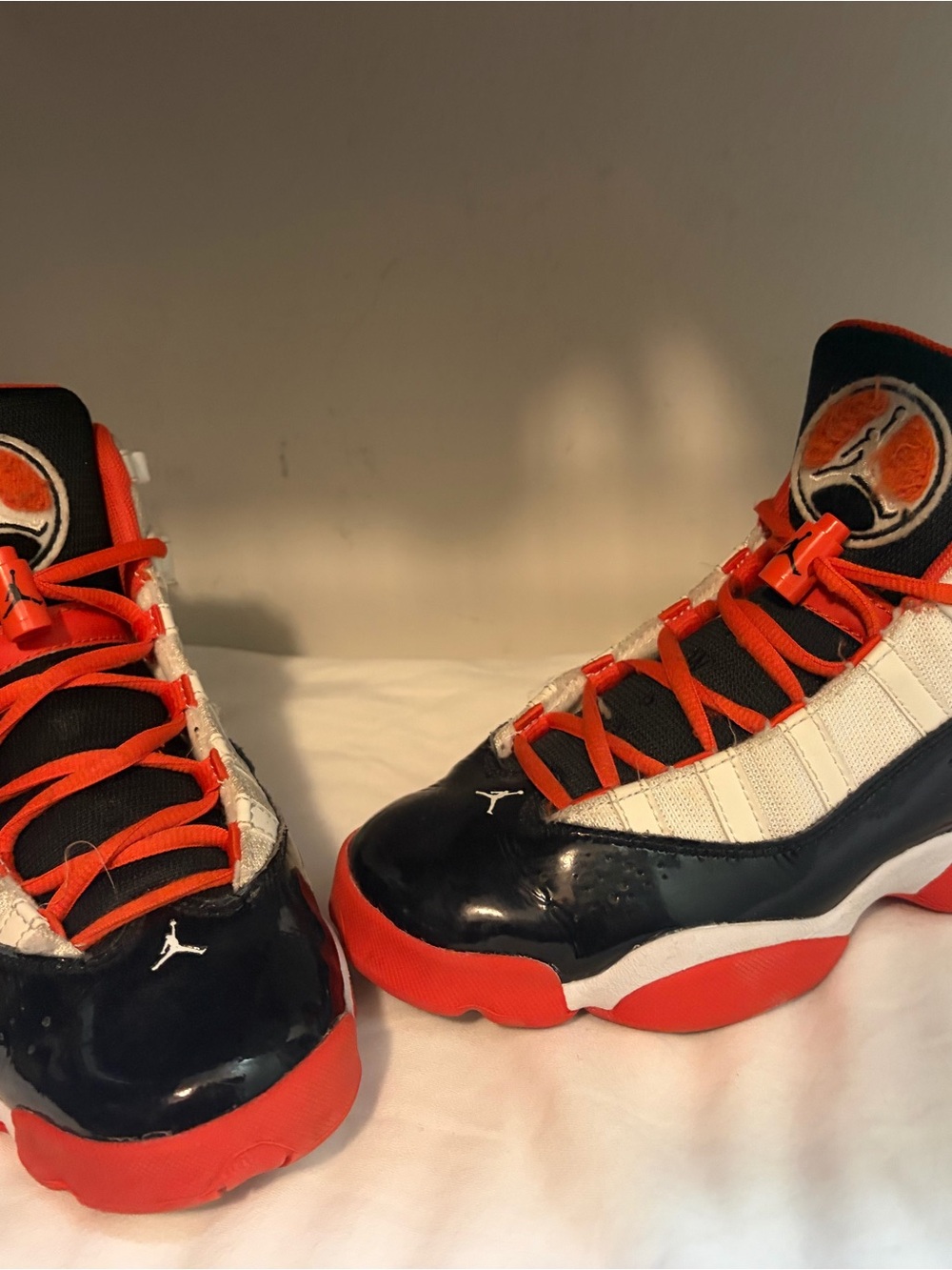 Jordan Kids High-Top Sneakers in Black, White & Orange